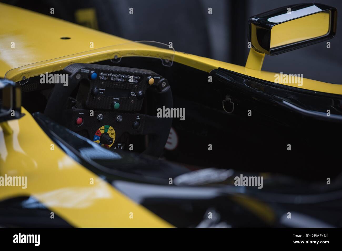 Racing car steering wheel controls detail in cockpit Stock Photo Alamy