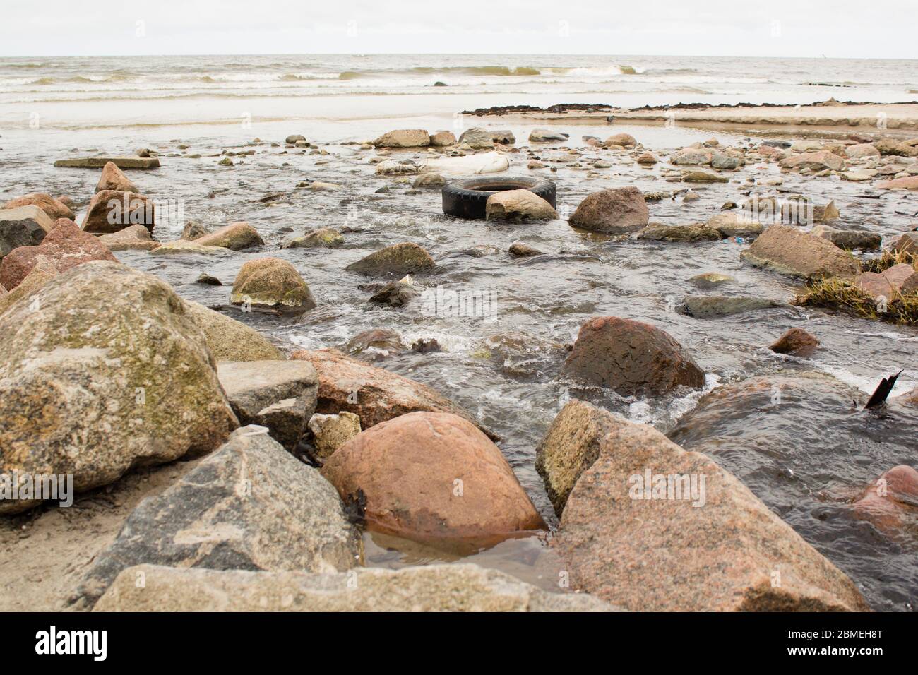 A polluted river flowing into the World Ocean Stock Photo - Alamy