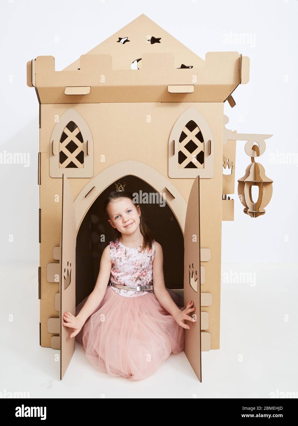 The princess play with cardboard castle tower. Stock Photo