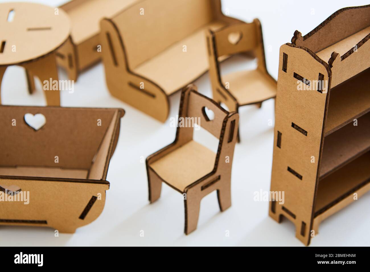 Dollhouse furniture from cardboard. Concept of Circular economy