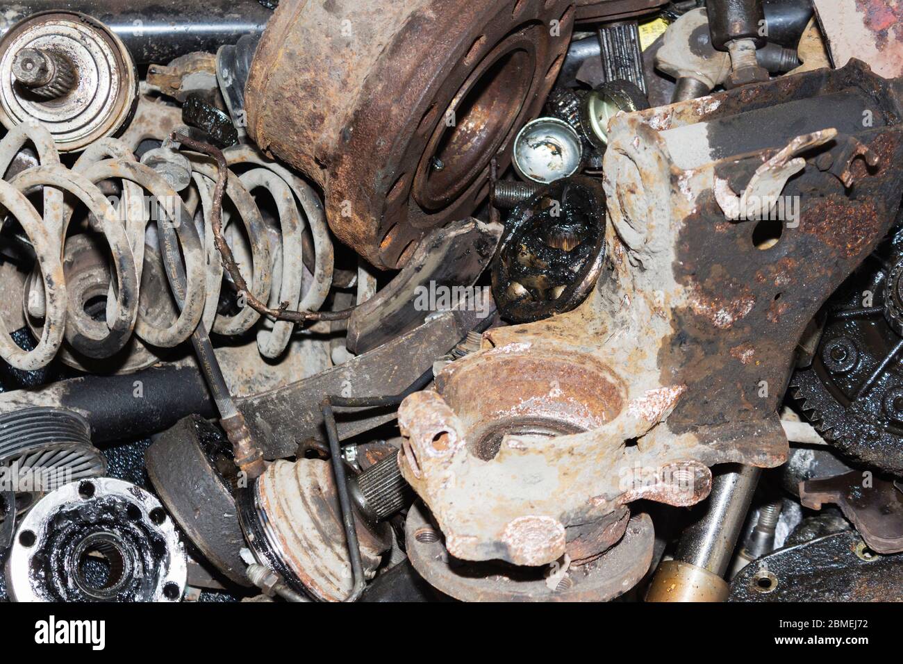 Useless, worn out rusty auto parts and other parts Stock Photo