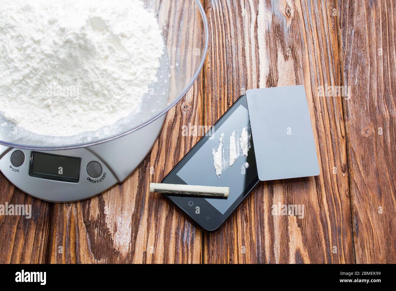 A lot of drugs, weighing them on the scales. Copy-paste. Kriminal Stock Photo