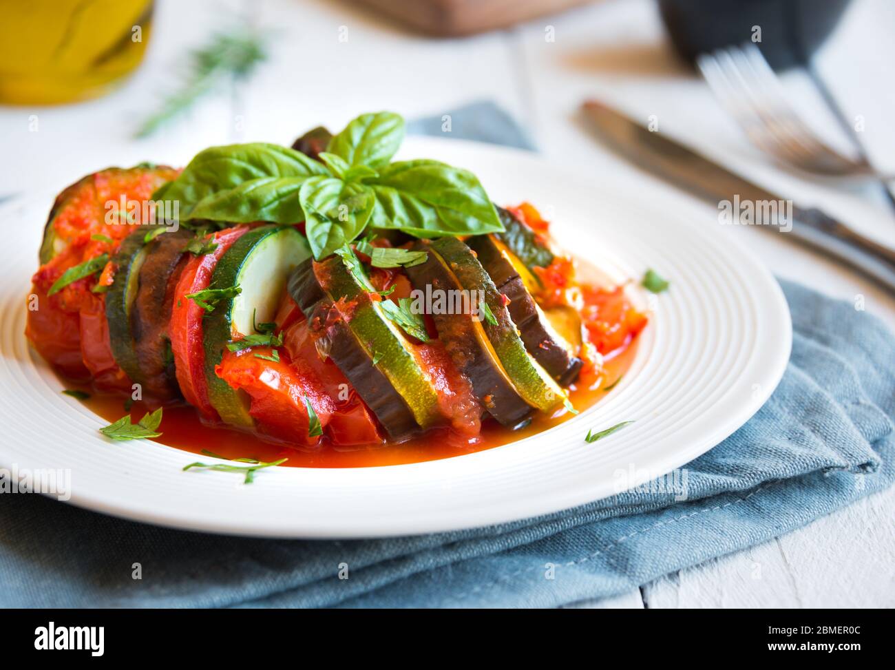 Homemade ratatouille made with sliced vegetables zucchini, tomatoes