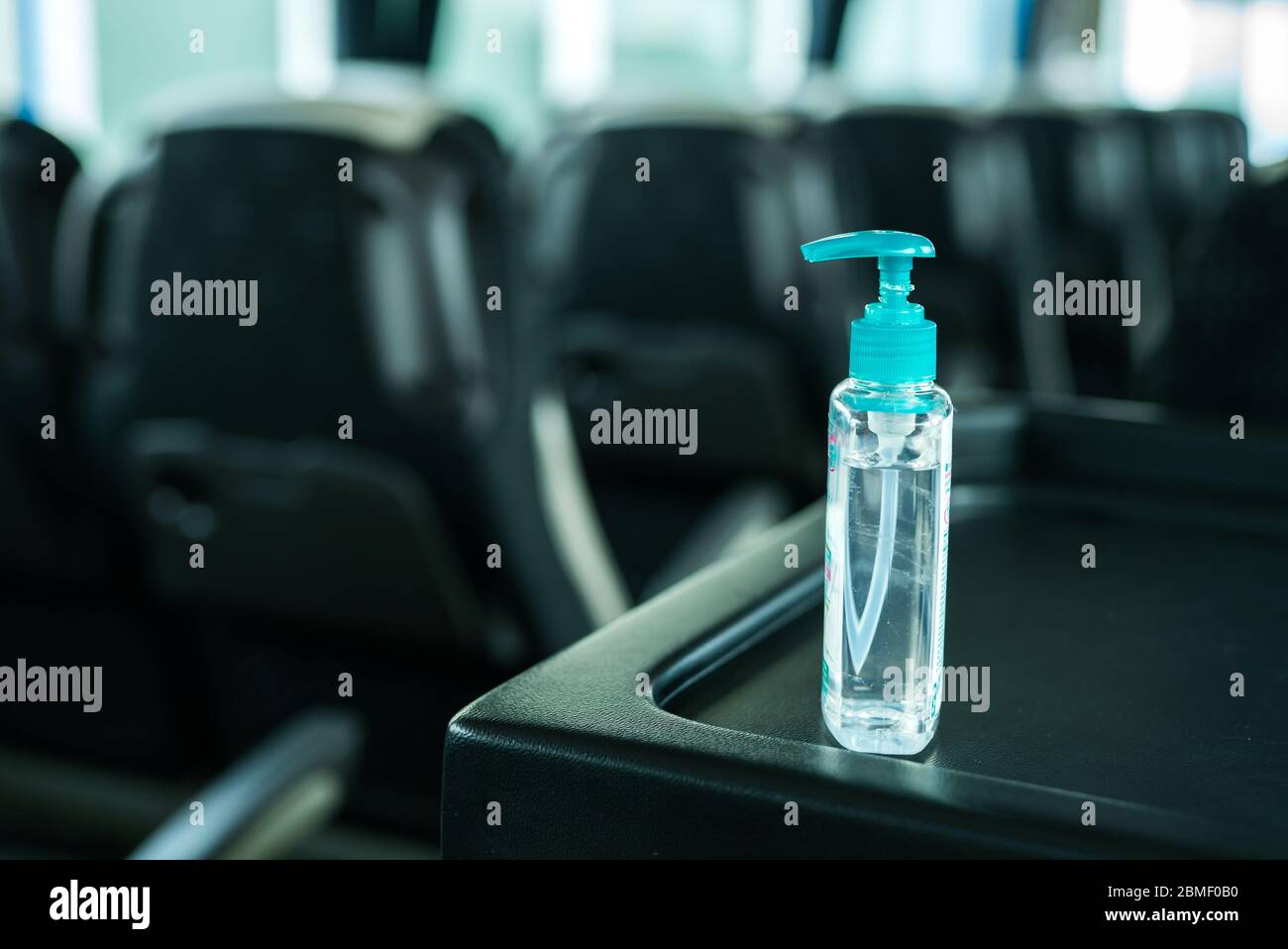 Required free hand sanitizer on the bus, compliance with hygiene regulations on public transport. Stock Photo