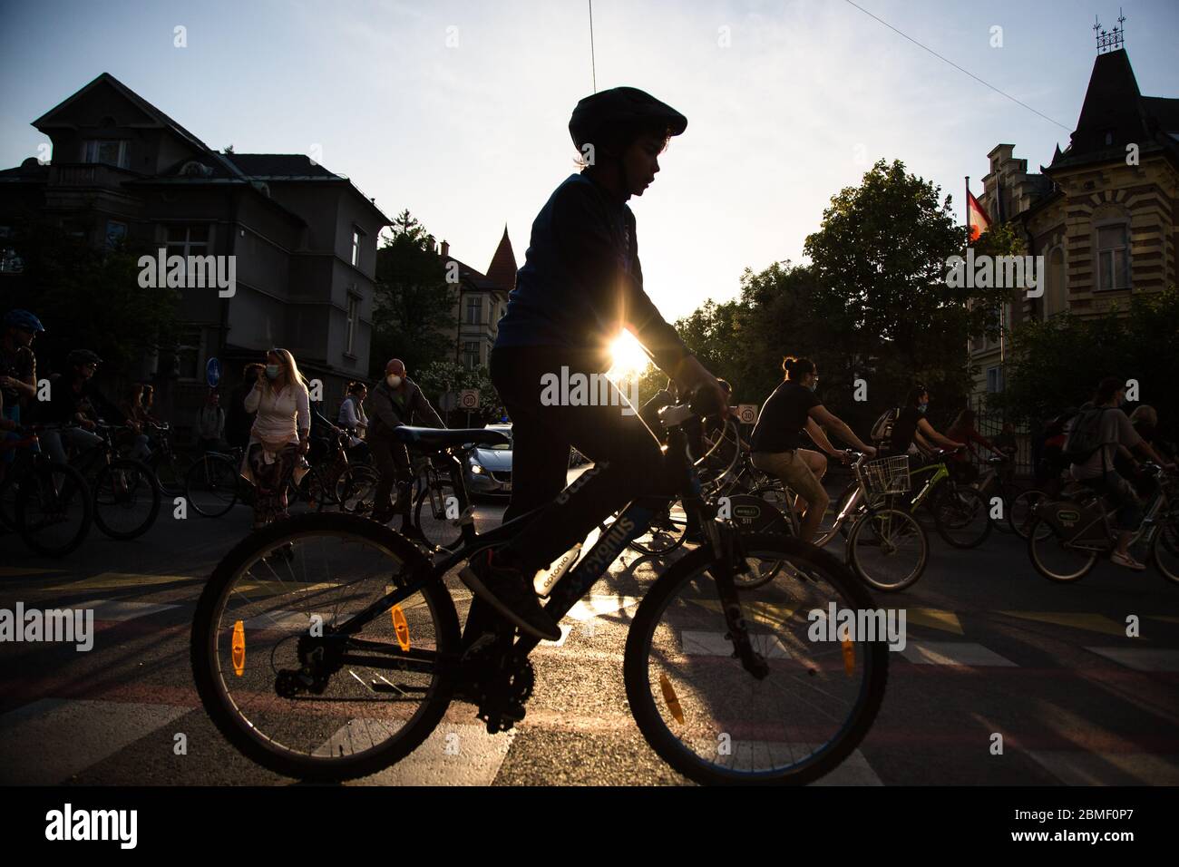 Ljubljana, Slovenia, May 8, 2020: A boy rides his bicycle  during an anti-government protest amid the coronavirus crisis. Following whistleblower's revelations of corruption in the government of Janez Janša and accusations of its undemocratic rule over five thousand people rode bicycles around government buildings in sign of protest. Stock Photo