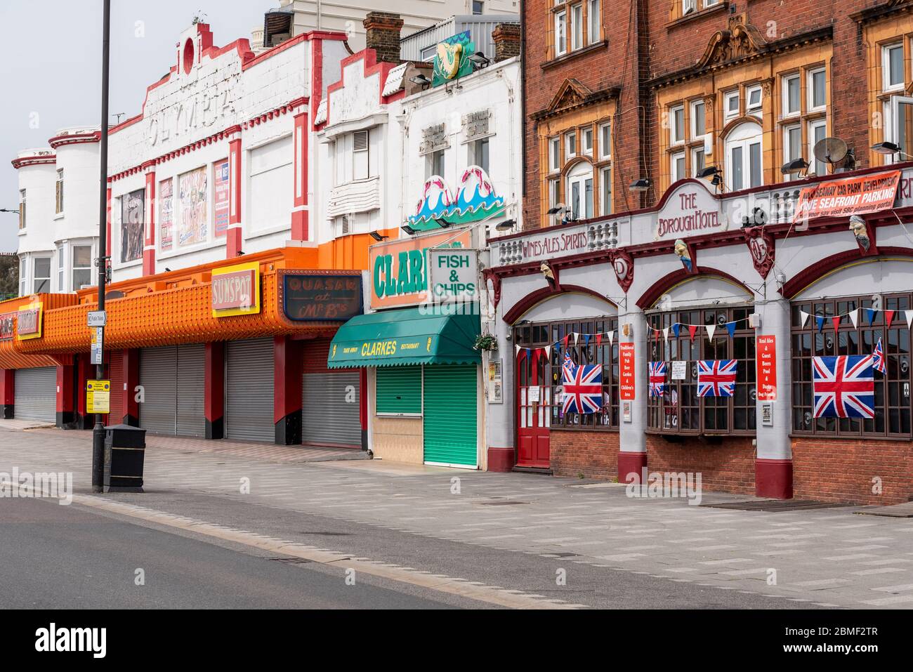 Closed businesses on sunny day in Southend on VE Day Bank Holiday during COVID-19 Coronavirus pandemic lockdown period. Shut amusement arcade. British Stock Photo