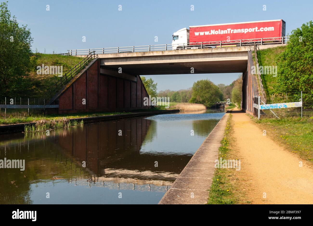 Newbury, England, UK - April 22, 2011: A lorry crosses the Kennet and Avon Canal at Higg's Lock on the A34 Newbury Bypass viaduct. Stock Photo