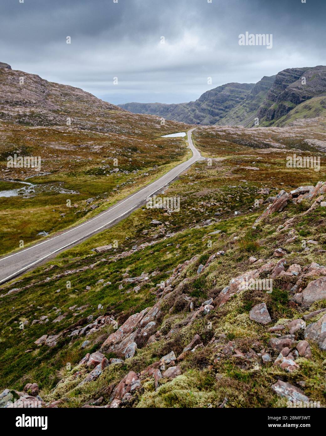 The Bealach na Ba mountain pass road crosses moorland at its summit between Meall Gorm and Beinn Bhan mountains in Wester Ross in the Highlands of Sco Stock Photo