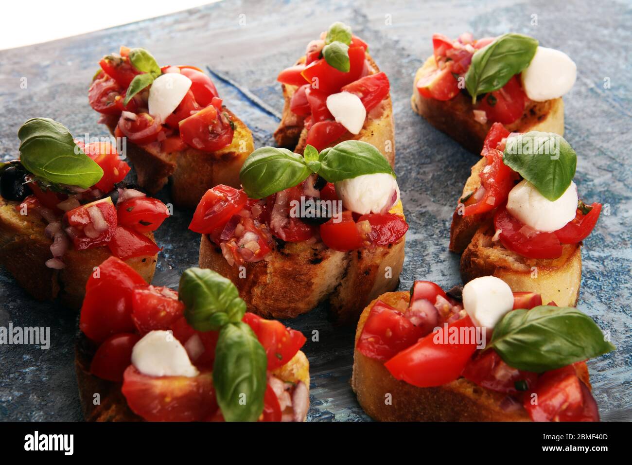 Traditional italian bruschetta with cherry tomatoes, cream cheese