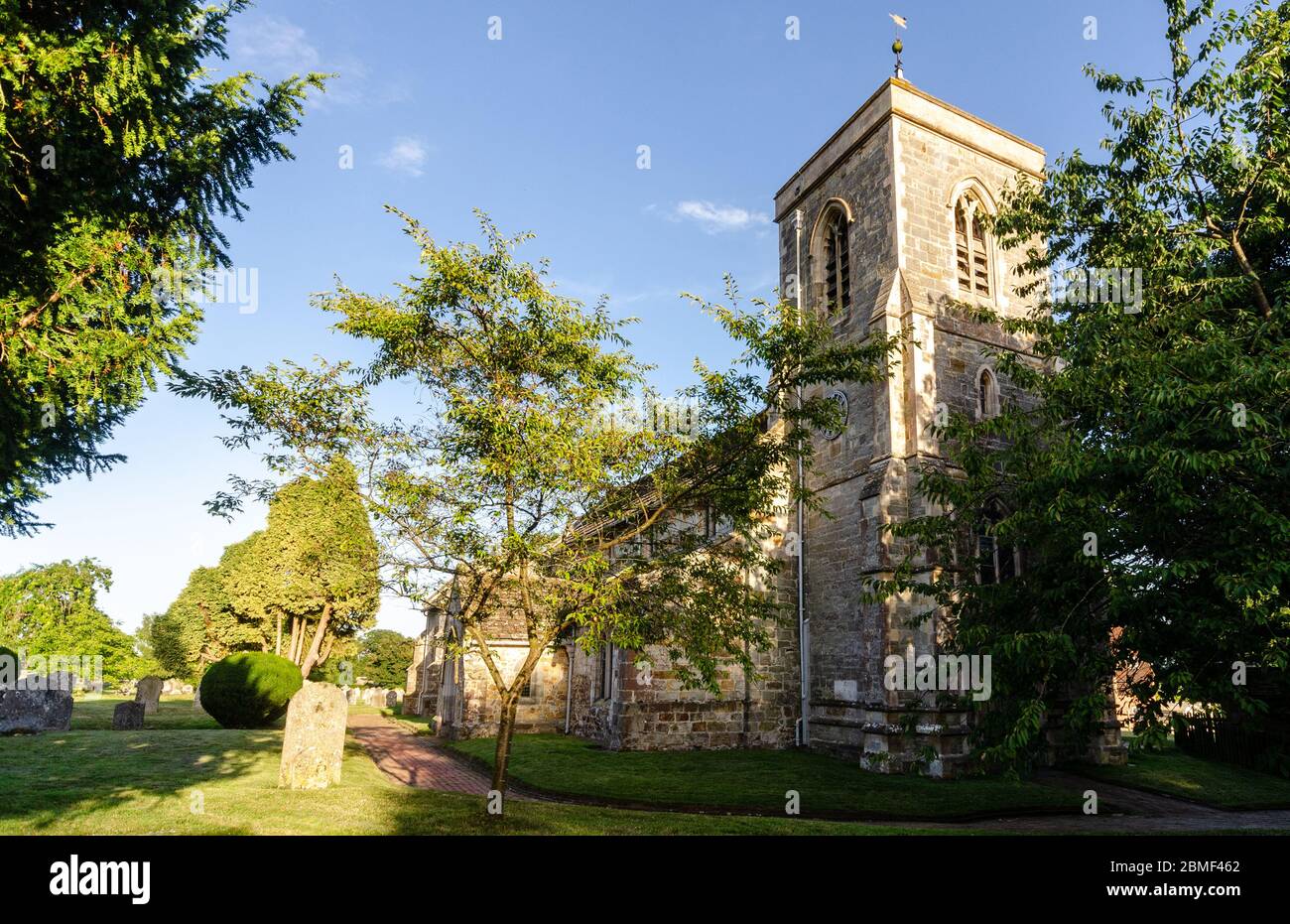 Uckfield, England, UK - August 21, 2013: Evening sun shines on the tower of Framfield Church in the Wealden district of East Sussex. Stock Photo