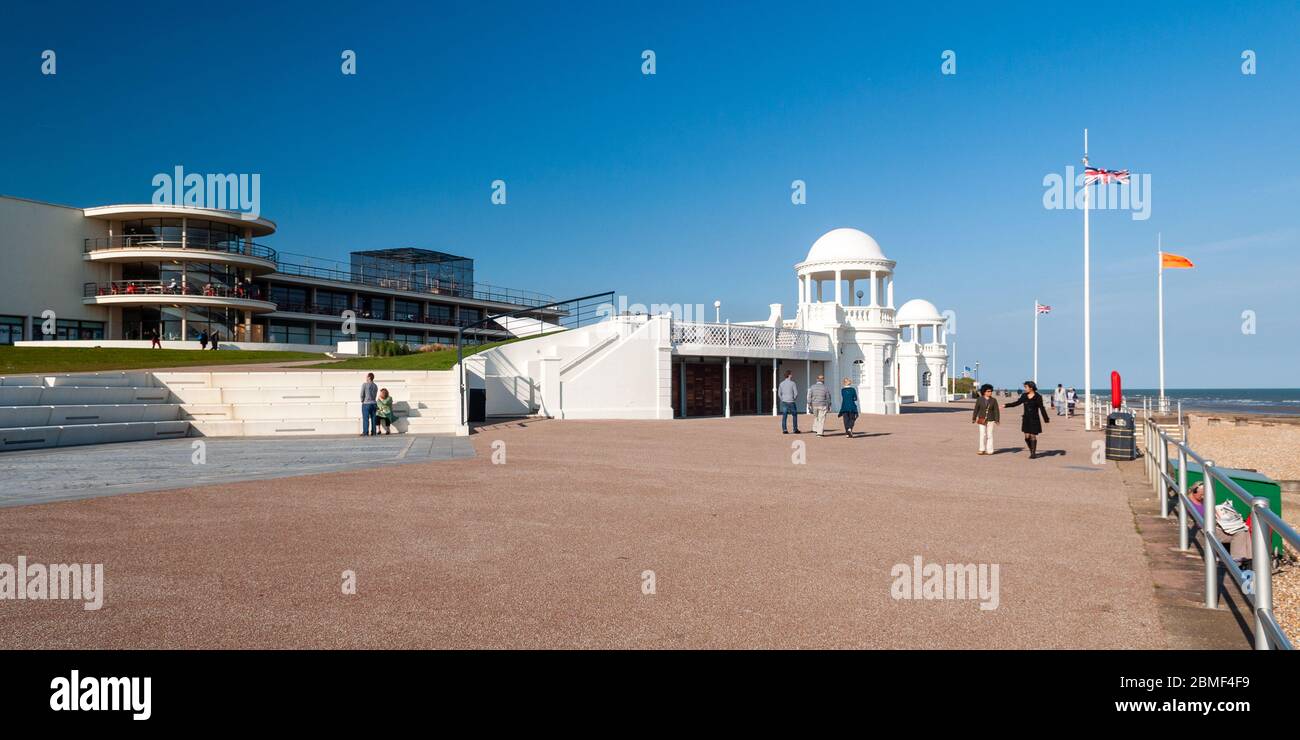 Bexhill on Sea, England, UK - June 8, 2013: People walk on the promenade outside the art deco De La Warr Pavilion on the seafront of Bexhill in East S Stock Photo