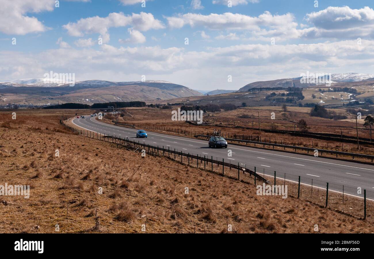 Tebay, England, UK - March 30, 2013: Traffic flows on the M6 motorway near Tebay in Cumbria. Stock Photo
