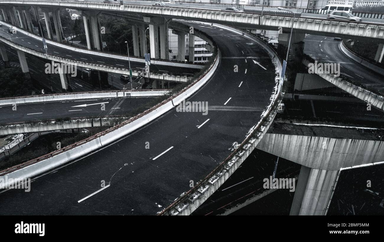 Aerial view of highway and overpass in city on a snowy day Stock Photo