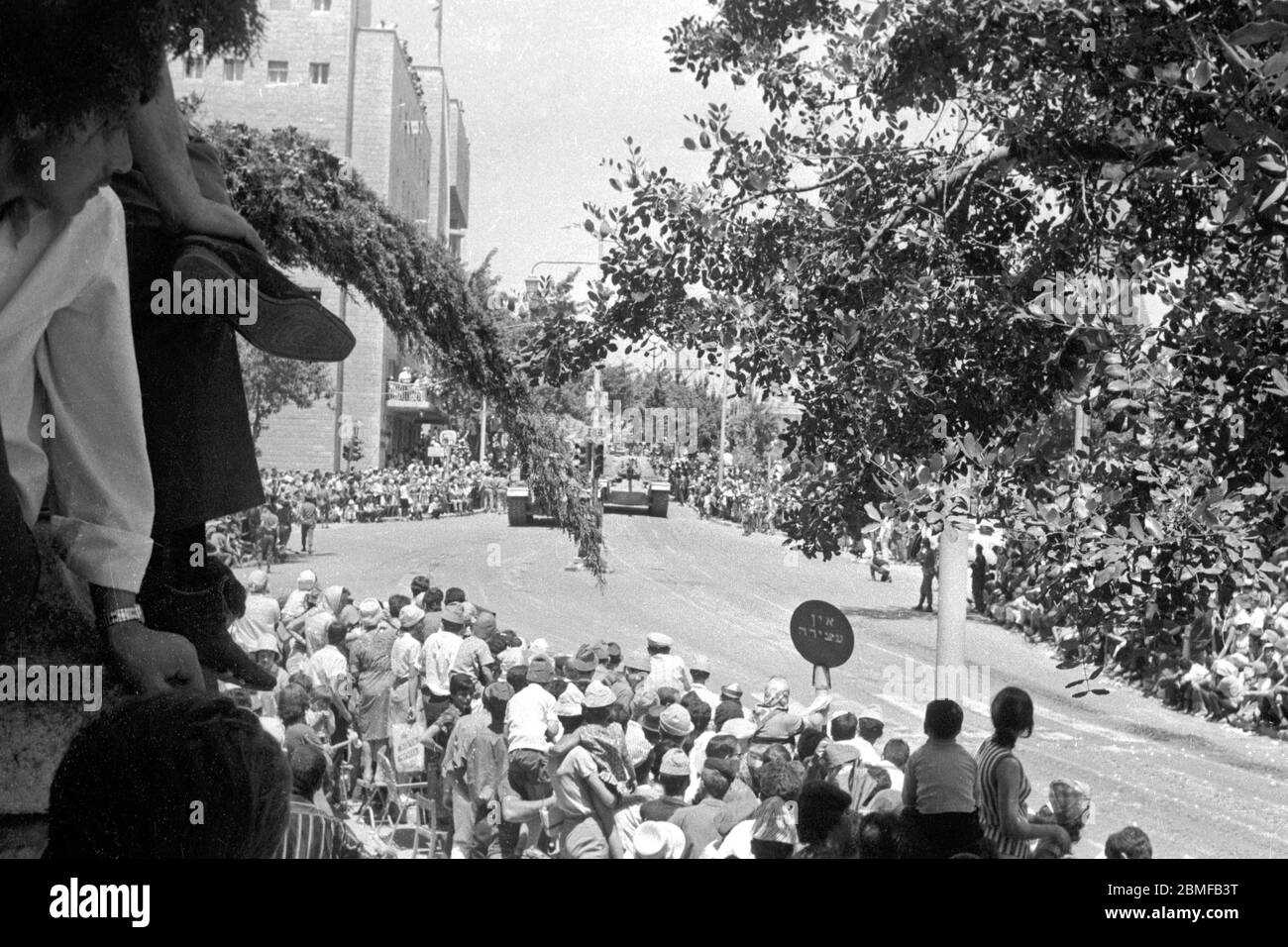 Israel, Jerusalem, 03 May 1968. Israelis watch military parade winding through the streets of west Jerusalem during 20th anniversary Independence Day Stock Photo