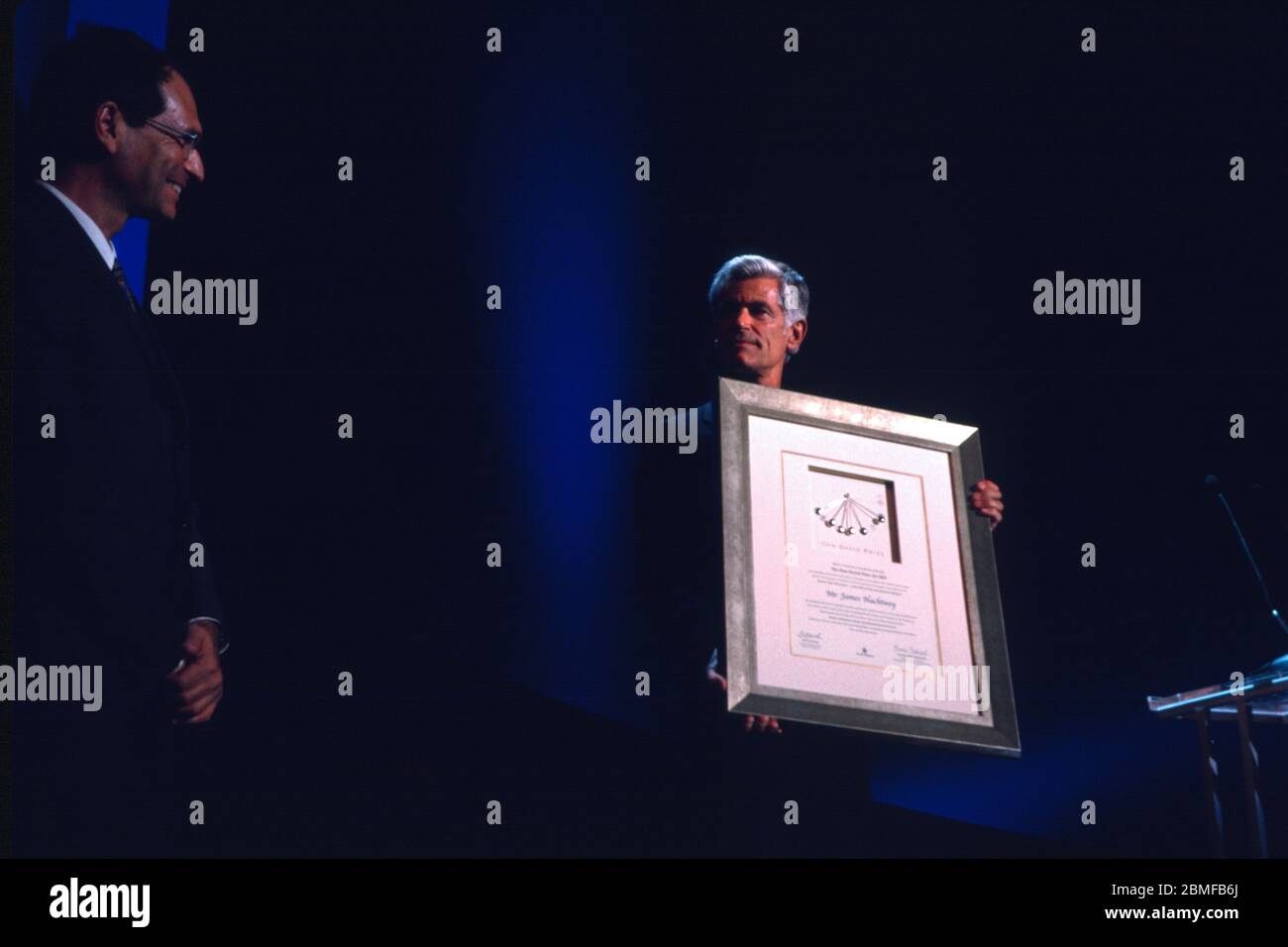 Israel, Tel Aviv 18th May 2003. American photojournalist and war photographer James Nachtwey holds a framed certificate of his Dan David award of US$1 million for the 'Present  Print & electronic media' theme received by Dan David  Foundation and Tel Aviv University during a presentation ceremony in Tel Aviv University, Israel. Stock Photo