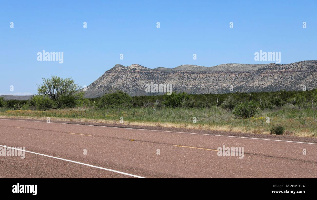 A view of a butte in the distance from a Sanderson Canyon roadside