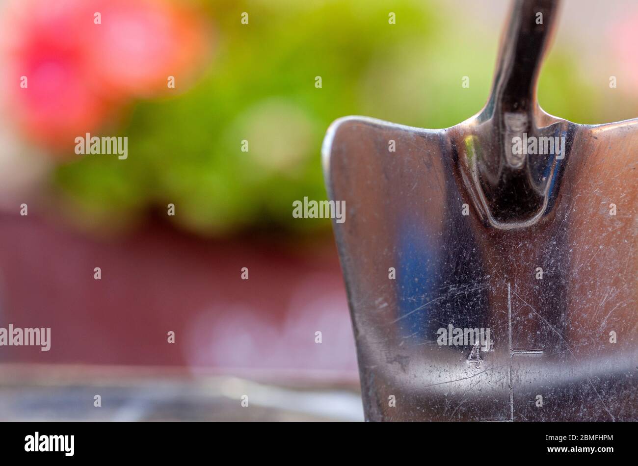 Garden hand trowel with 4 inch depth measurement marked Stock Photo Alamy