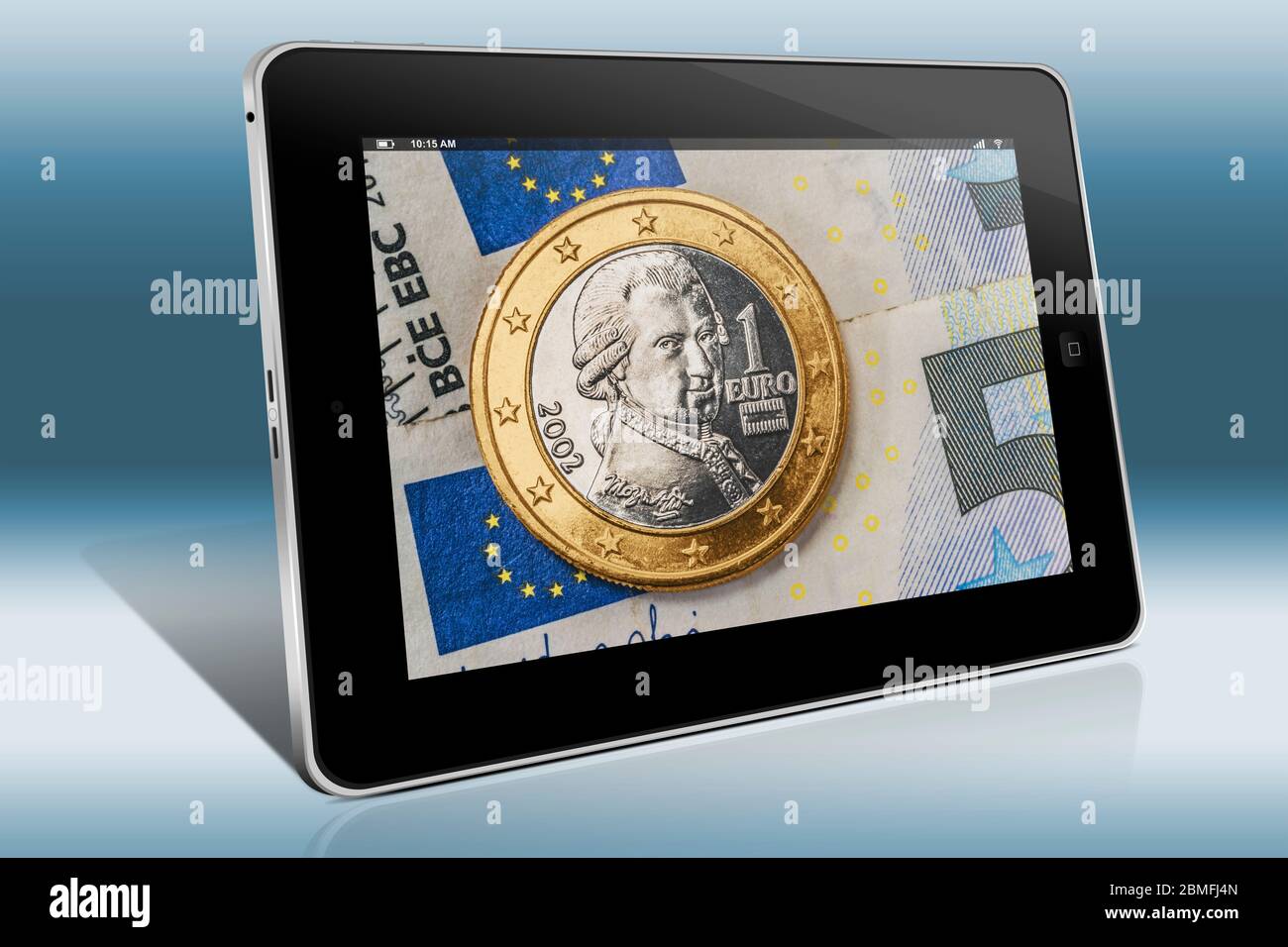 a 1 euro coin from Austria on euro banknotes, view on a Tablet PC Stock Photo