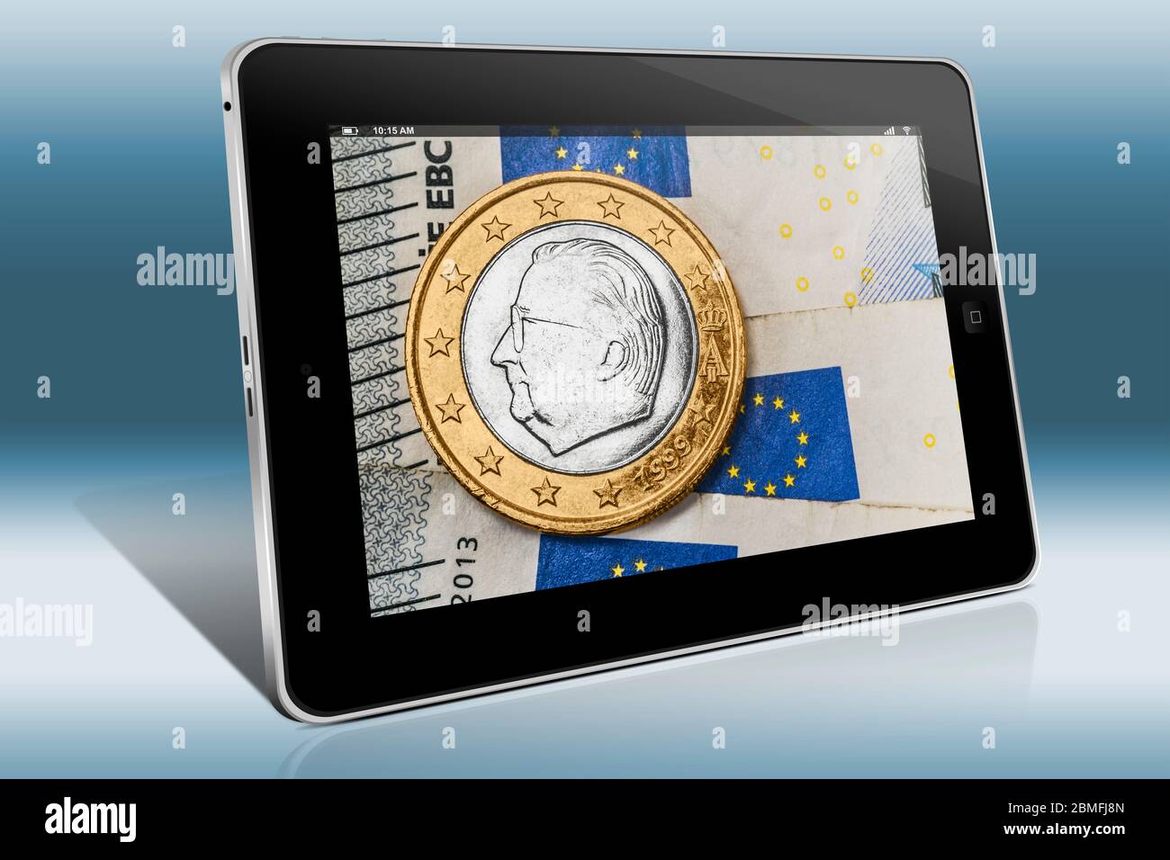 a 1 euro coin from Belgium on euro banknotes, view on a Tablet PC Stock Photo