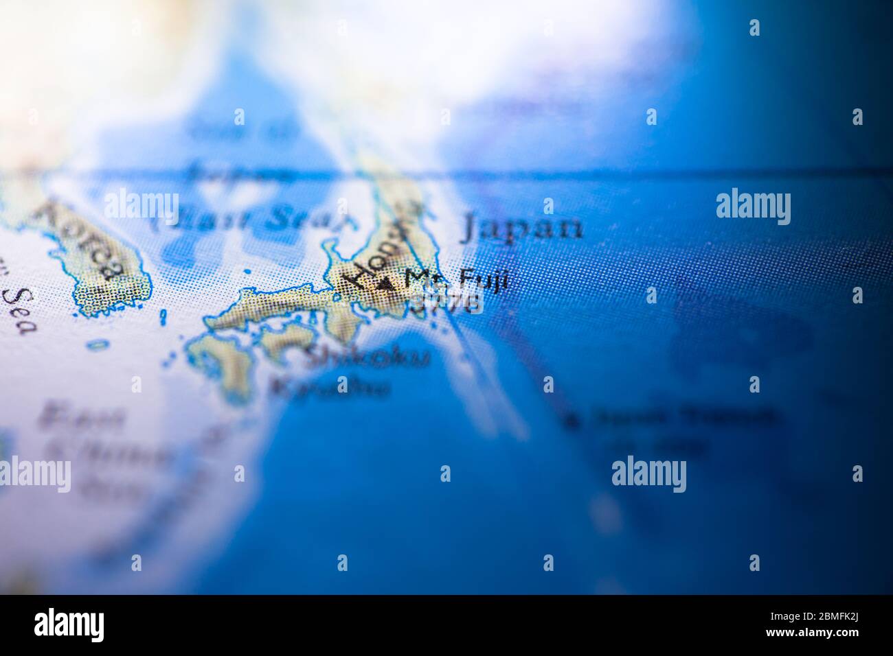 Shallow depth of field focus on geographical map location of Mount Fuji