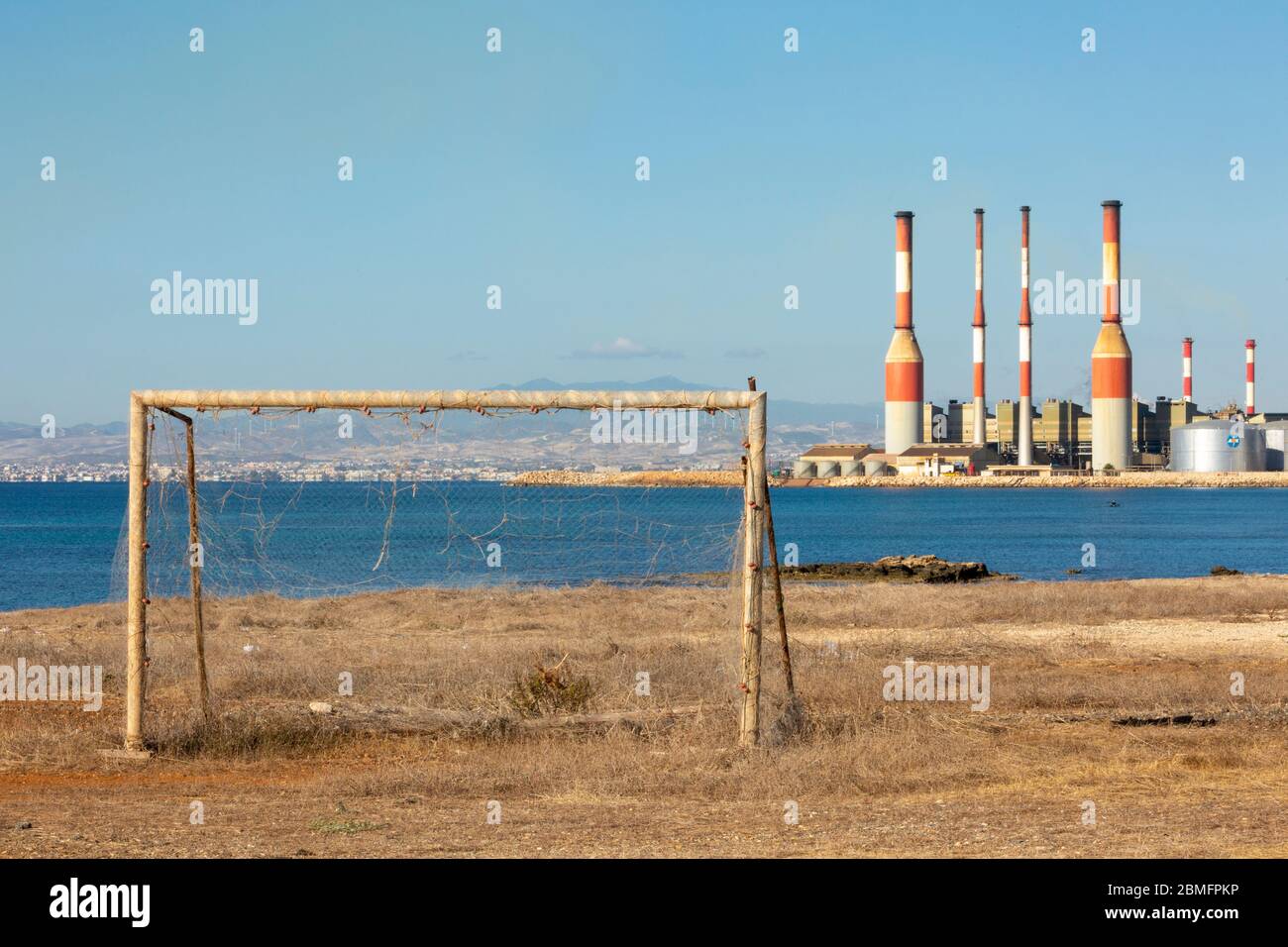 Old goal posts with Dhekelia Power Station in the background, Dhekelia Bay, Cyprus Stock Photo