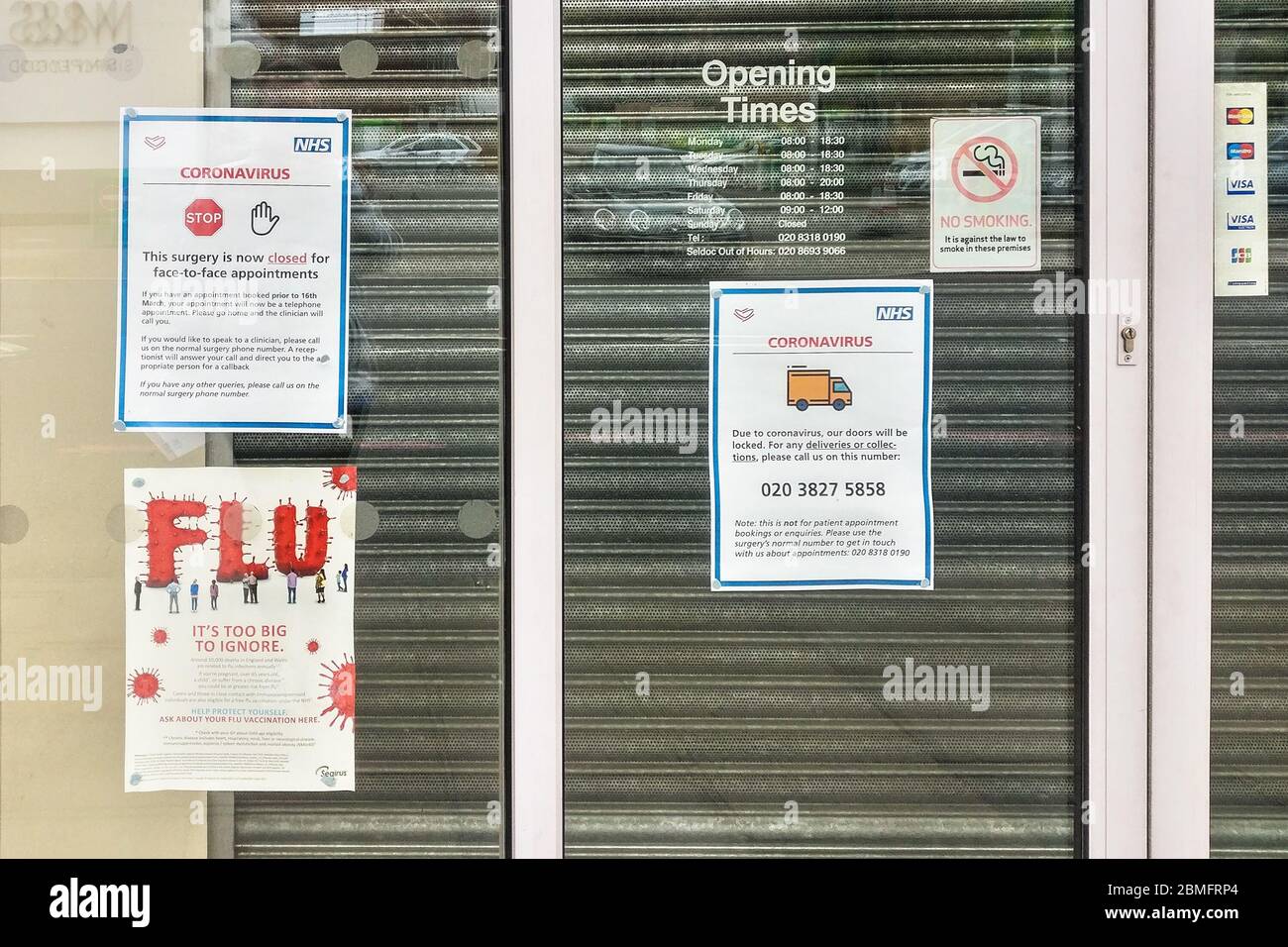 London, United Kingdom - March 28, 2020: Notice about closure because of coronavirus covid-19 outbreak on local surgery ambulance in Lewisham, London. Stock Photo
