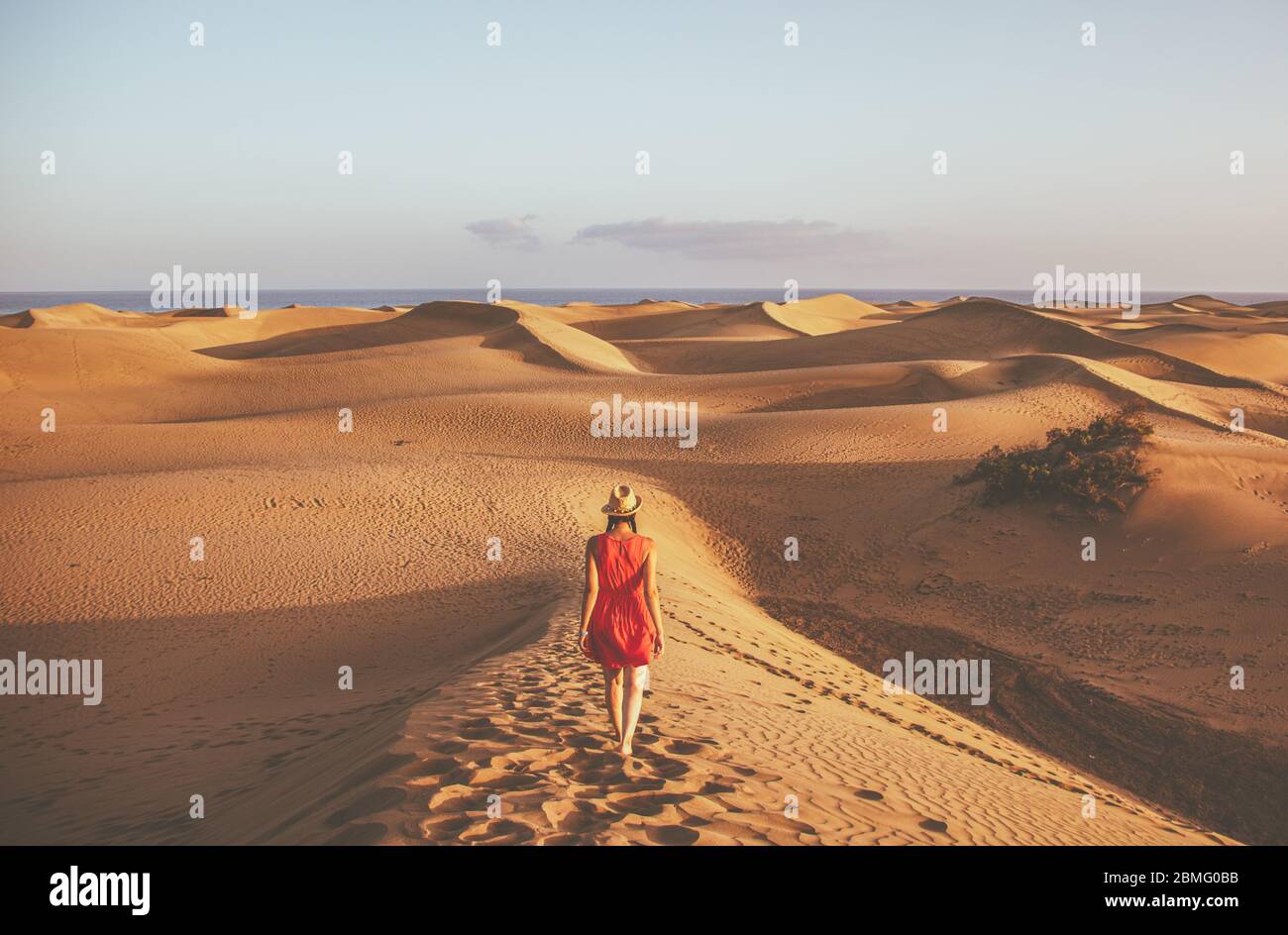 Woman walking on the Maspalomas Sand Dunes, Gran Canaria Stock Photo