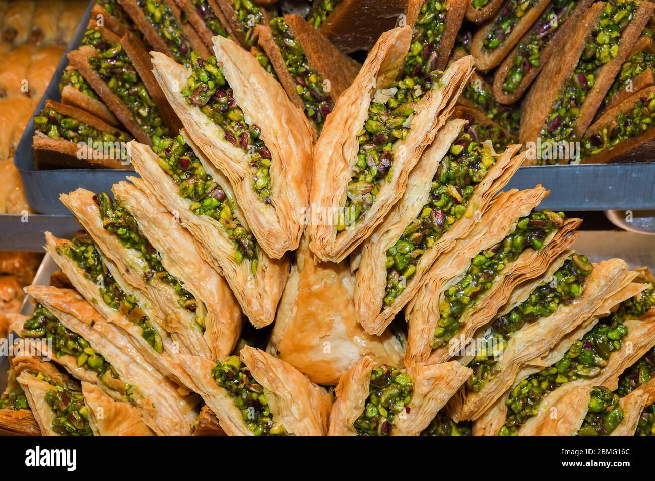 Traditional baklava sweet dessert delights, cataif pastry during hotel brunch buffet outside outdoor in the garden by the pool. Fresh Food Buffet Brun Stock Photo