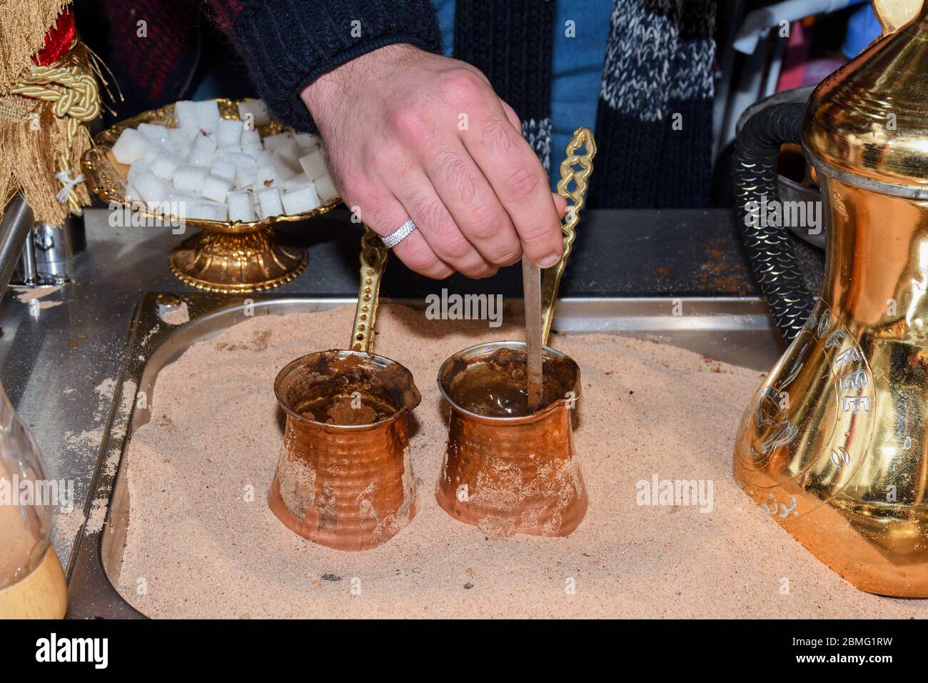 Antique coffee grinder with coffee beans, various types dark black