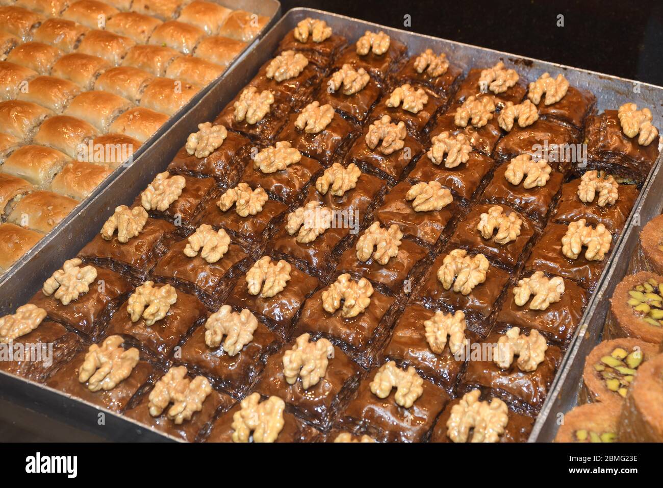 Traditional baklava sweet dessert delights, cataif pastry during hotel brunch buffet outside outdoor in the garden by the pool. Fresh Food Buffet Brun Stock Photo