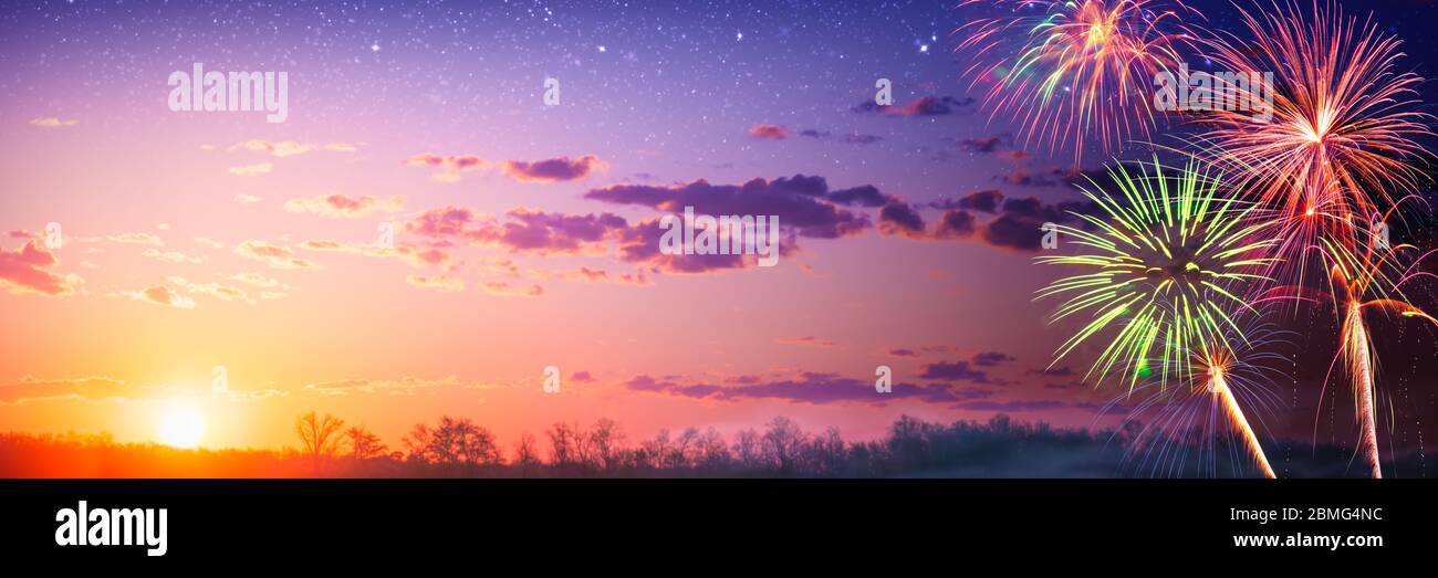 Fireworks At Sunset With Starry Sky - Independence / Memorial Day Celebration Concept Stock Photo