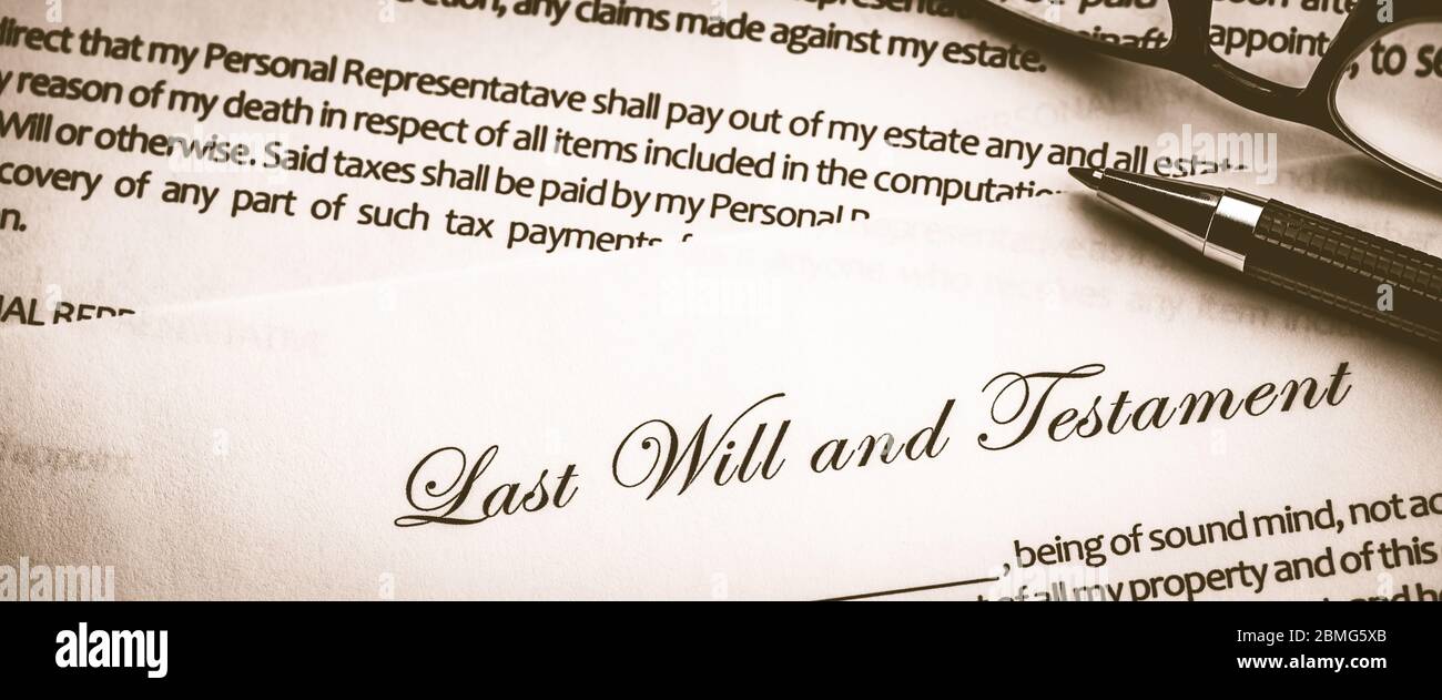 Last Will And Testament Document With Pen And Reading Glasses - Death And Inheritance Concept Stock Photo