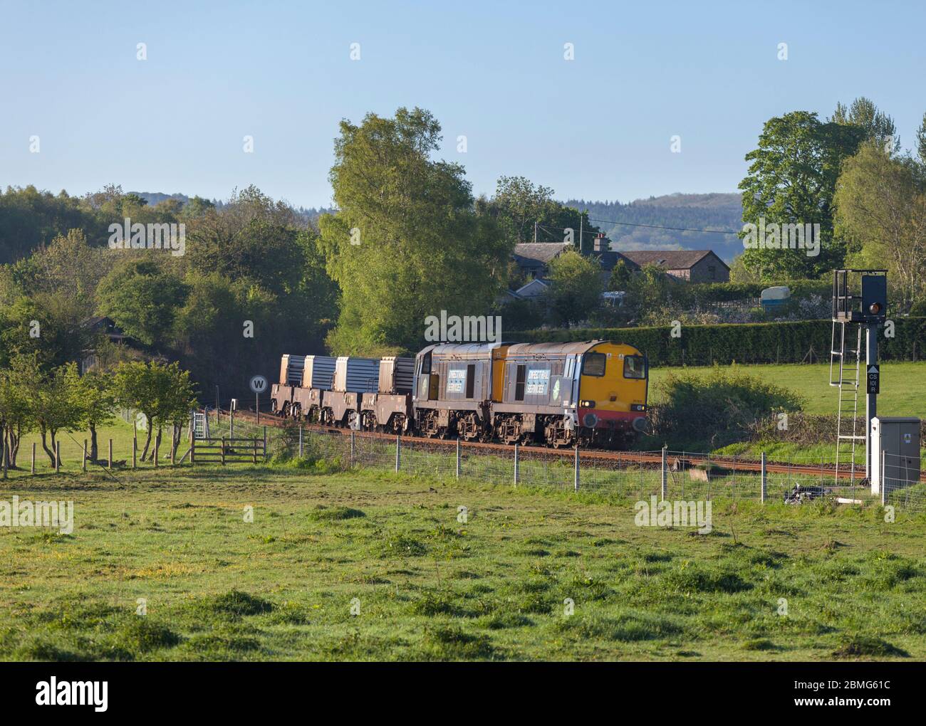 Direct rail Services class 20 locomotives 20302 + 20304 hauling a nuclear flask train through the countryside on the Cumbrian coast railway Stock Photo