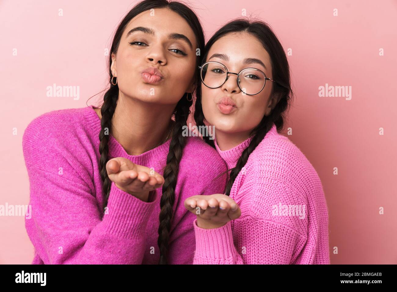 Premium Photo  Two young women in pink bralettes laughing and smiling