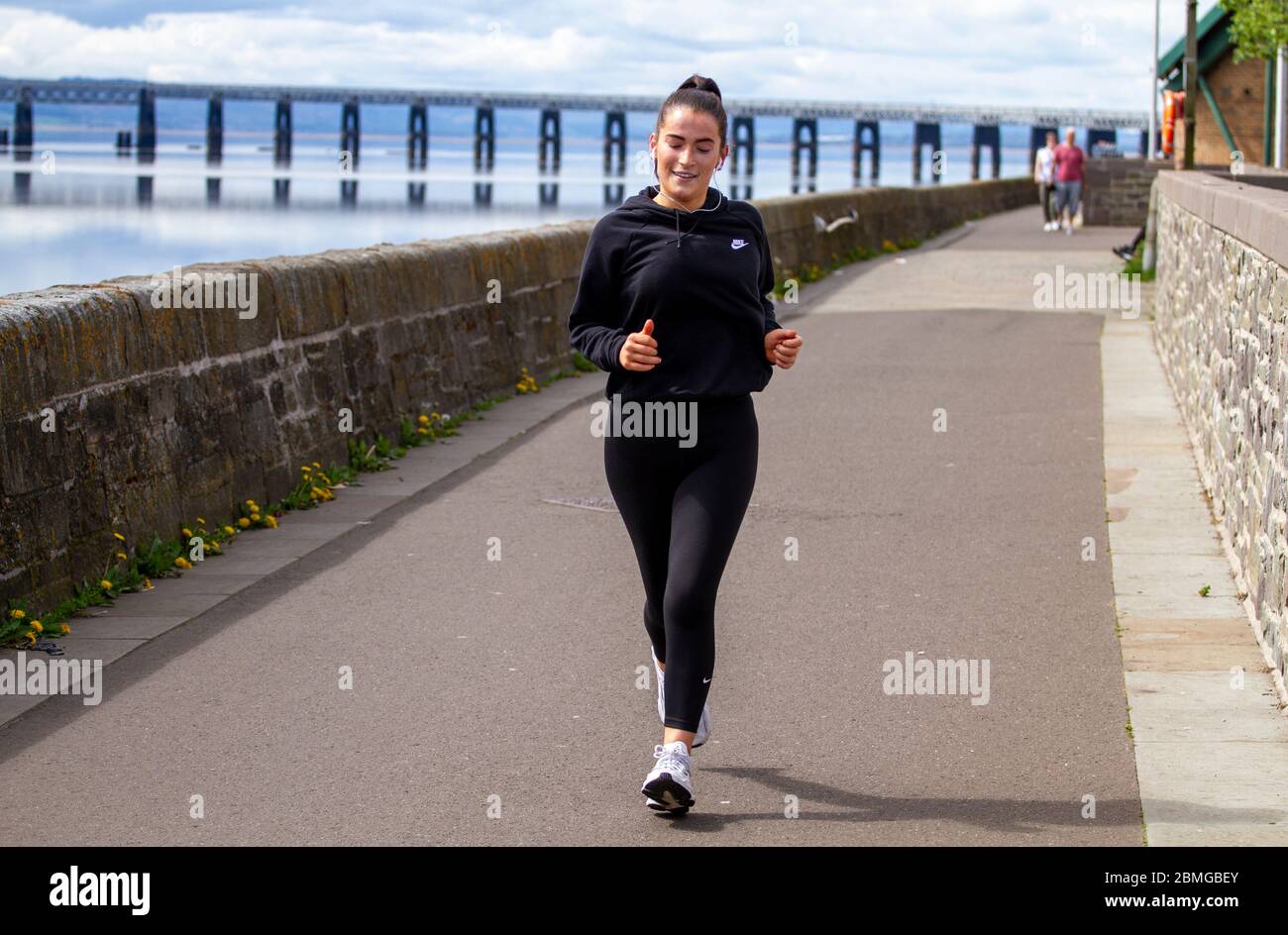 Runner with both feet off ground hires stock photography and images