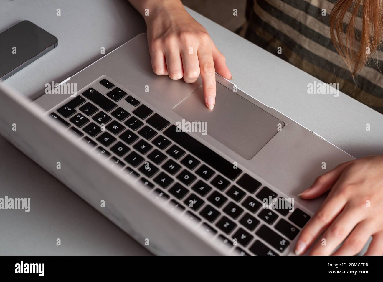 Young woman working at home, Student girl using laptop computer  , work or studying from home, freelance, online learning, distance education concept Stock Photo