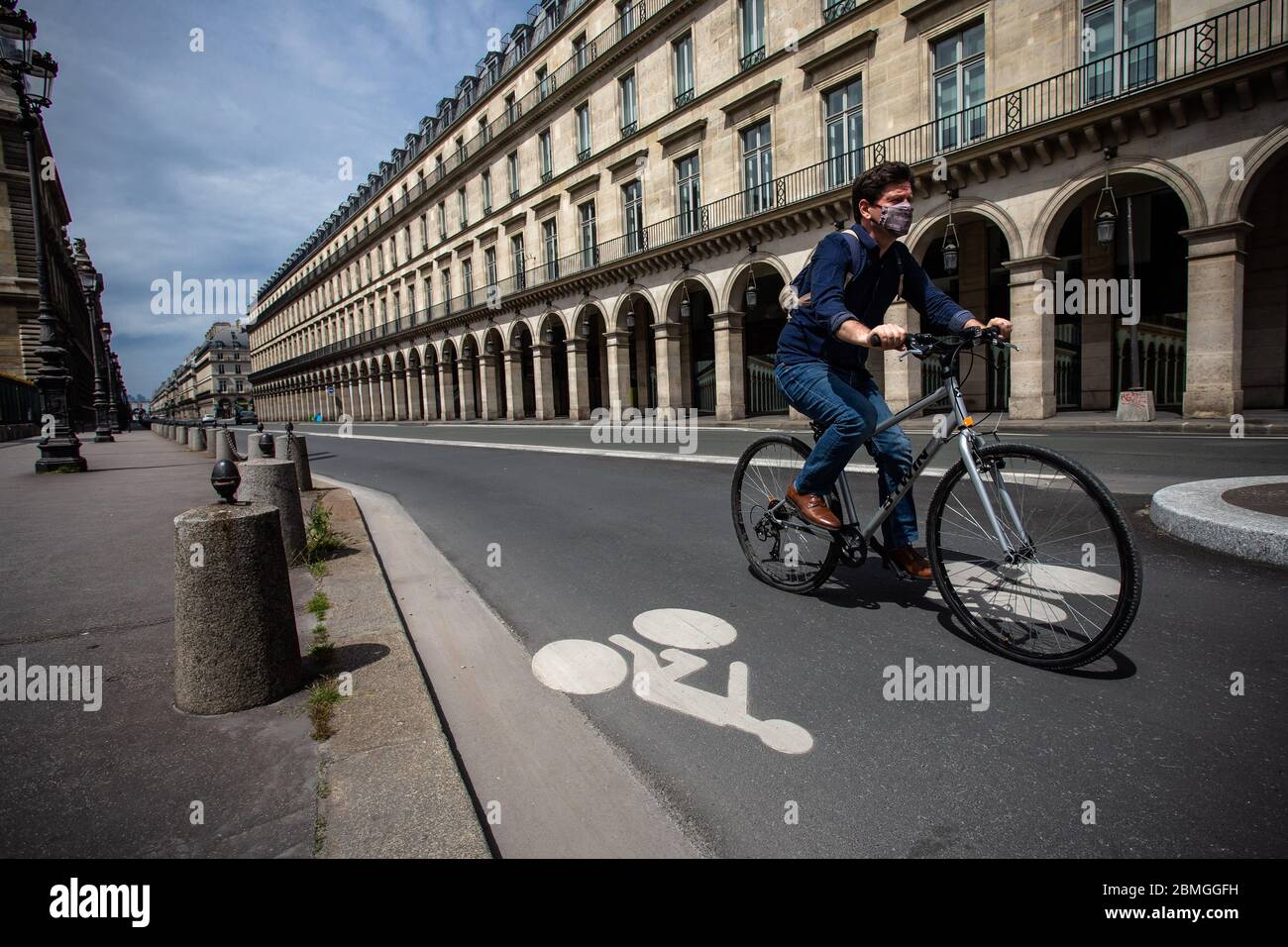 Paris France. 8th May 2020. A man rides a bicycle on the famous