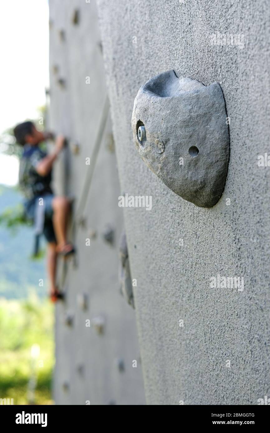 Nakhon ratchasima, Thailand - October 16, 2017: Close up, the grip of the outdoor climbing wall, an artificially constructed wall with grips for hands Stock Photo