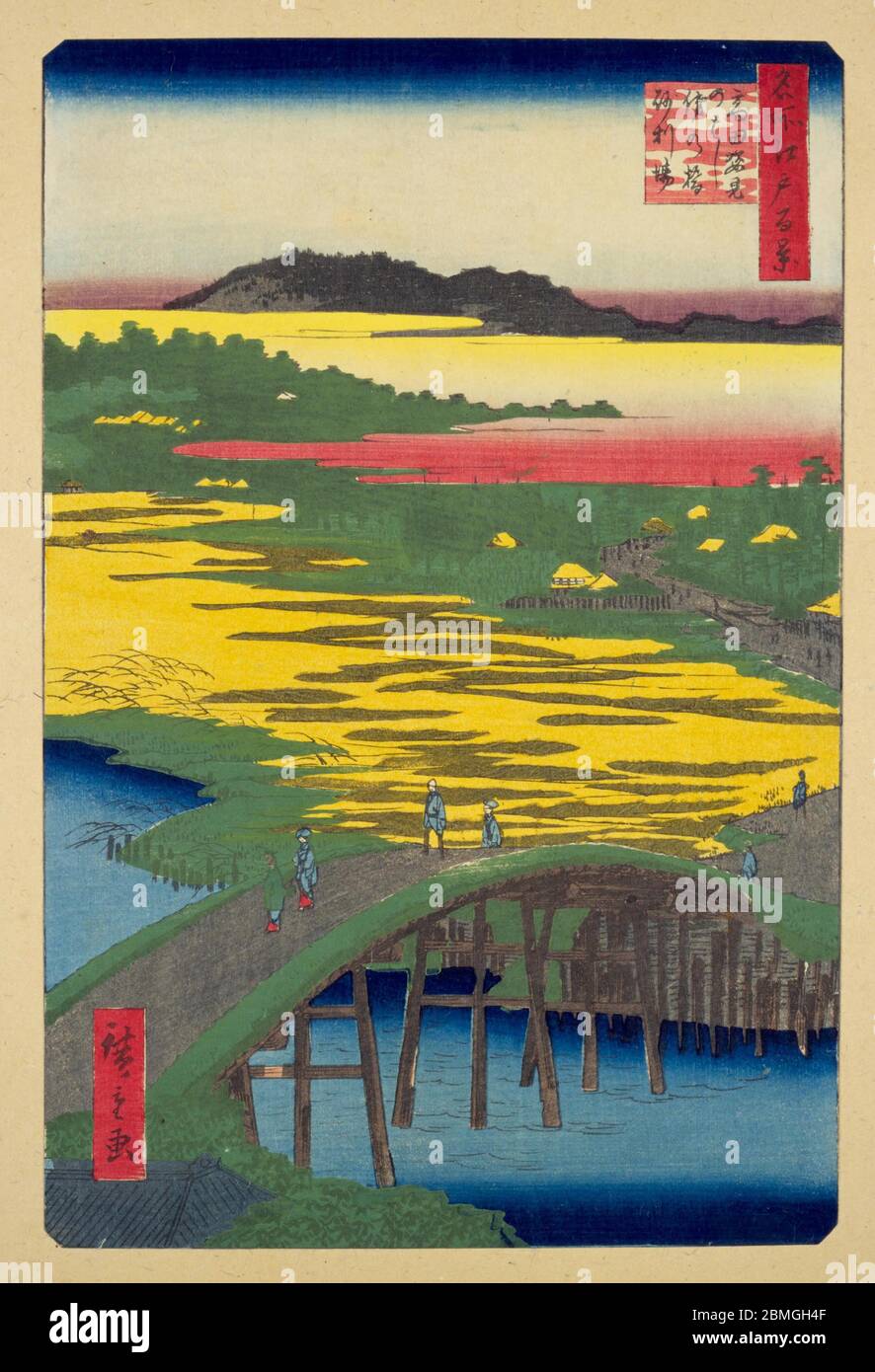 [ 1850s Japan - Gold Colored Ricefields ] —   The Omokage Bridge over the Kandagawa River and the gold colored Hikawa ricefields in Edo (current Tokyo), 1857 (Ansei 4).  This woodblock print is image 116 in One Hundred Famous Views of Edo (名所江戸百景, Meisho Edo Hyakkei), a series created by ukiyoe artist Utagawa Hiroshige (歌川広重, 1797–1858).  It is one of 20 winter scenes in the series.  Title: Sugatami Bridge, Omokage Bridge and Jariba at Takata (高田姿見のはし俤の橋砂利場, Takata Sugatami no hashi Omokage no hashi Jariba)  19th century vintage Ukiyoe woodblock print. Stock Photo