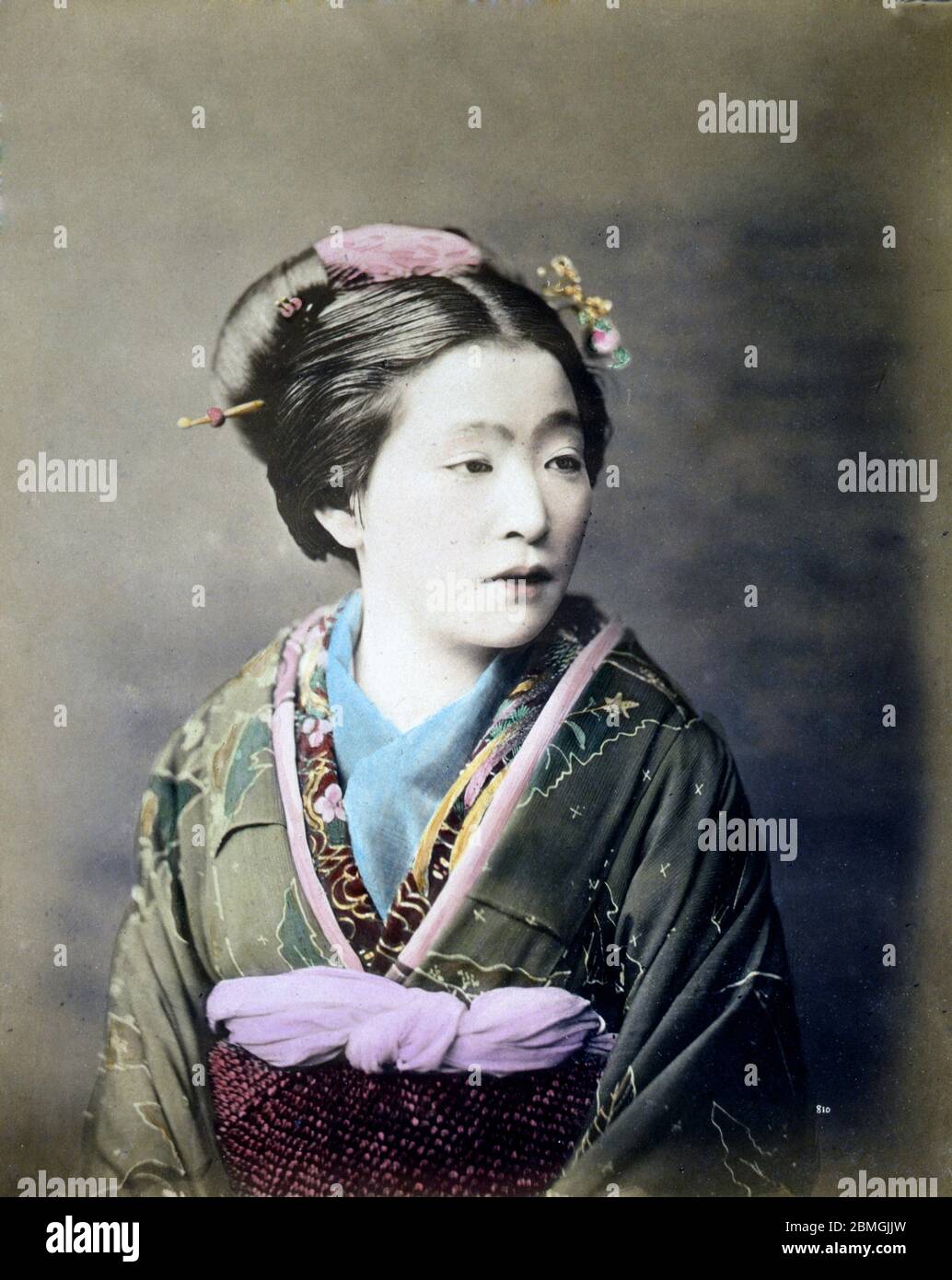 [ 1880s Japan - Japanese Woman in Kimono ] —   Woman in kimono and traditional hairstyle.  19th century vintage albumen photograph. Stock Photo