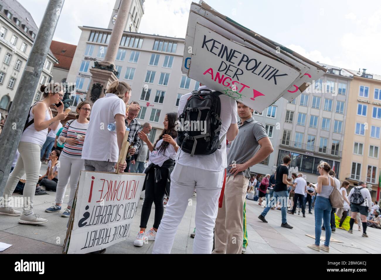 Munich, Germany. 09th May, 2020. Demonstrators stand with a poster with the inscription 'No politics of fear' in a crowd of people on Marienplatz. About 3000 people demonstrated against what they consider to be too strict infection protection regulations in Bavaria and Germany, partly in disregard of all corona distance rules. Credit: Peter Kneffel/dpa/Alamy Live News Stock Photo