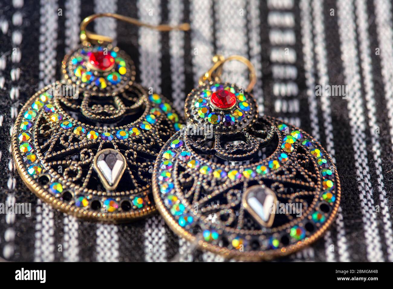 earrings inlaid with colored stones in oriental style Stock Photo