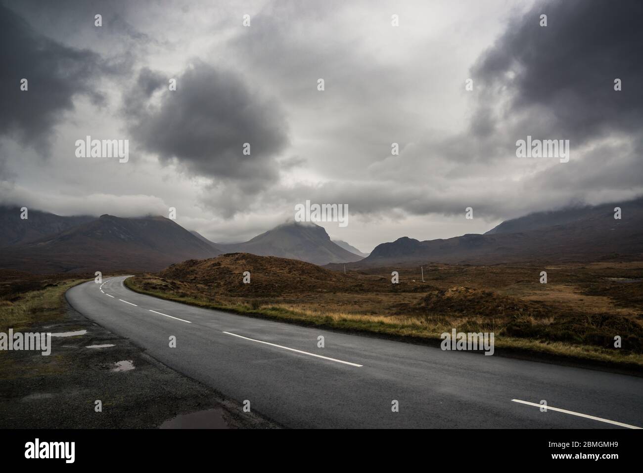 Just another damp road on a typical day on the Isle of Skye.  Damp, chilly, miserable, beautiful! Stock Photo