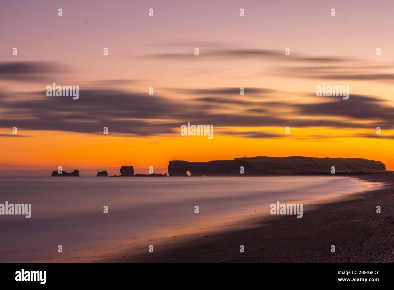 Dyrholaey and Reynisfjara beach at sunset Stock Photo