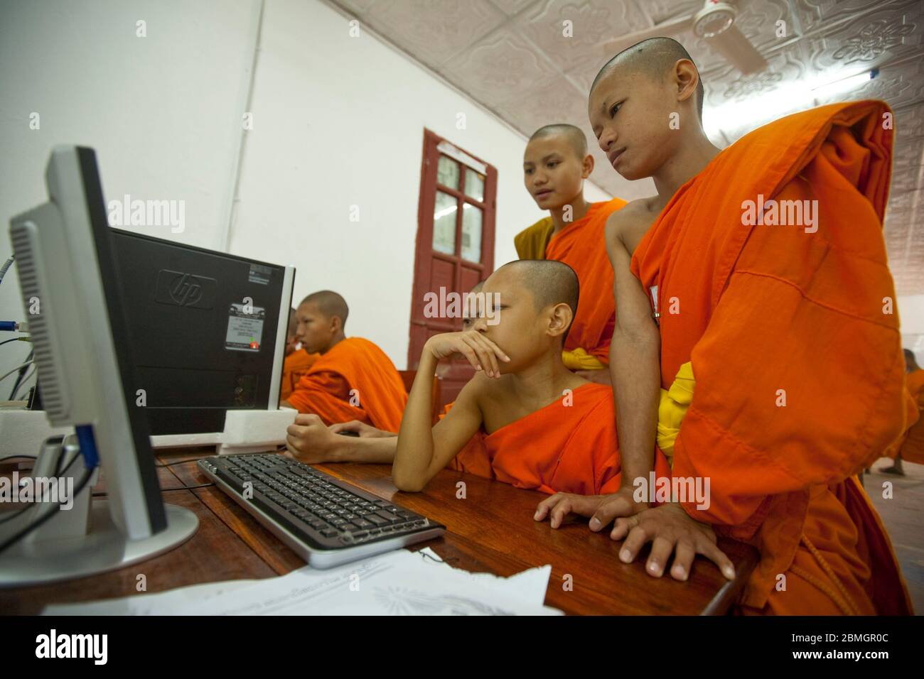 YOUNG BUDDHISTS MONKS USING COMPUTERS IN LUANG PRABANG, LAOS Stock ...