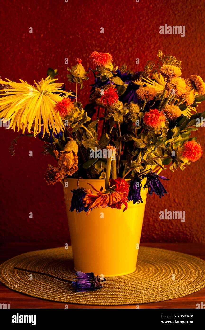 Wilting flowers including mums,chrysanthemums,carnations in yellow