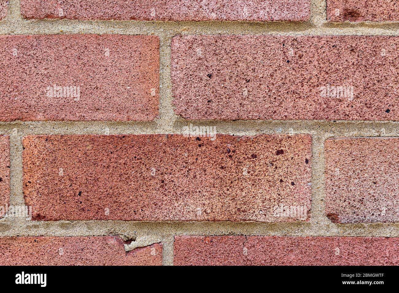 Red brick wall of mid1950 house texture and detail ideal for background image and blending into composite images and digital artwork. Stock Photo