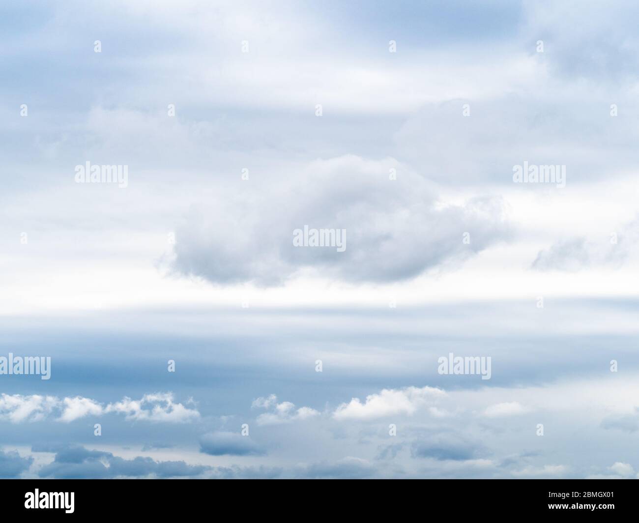 natural background - white clouds in gray sky on spring cloudy day Stock Photo