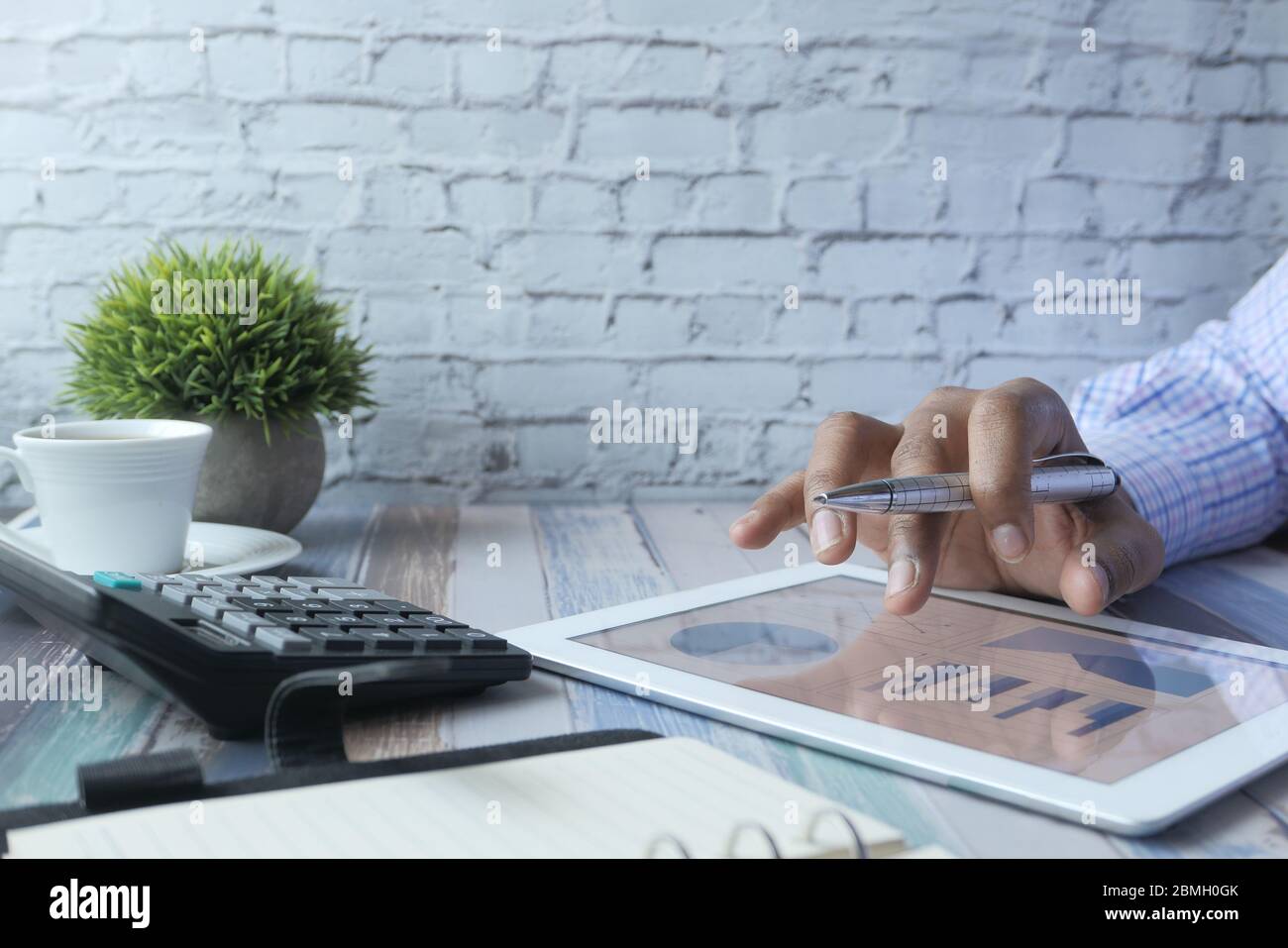 person hand working on digital tablet, Using self created chart Stock ...