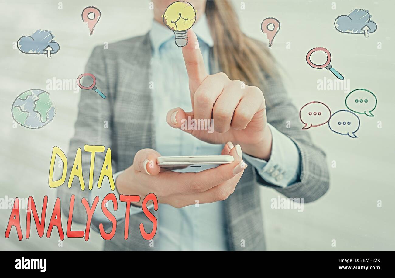 Writing note showing Data Analysts. Business concept for Programmer Design and Create Report Identifies patterns Stock Photo
